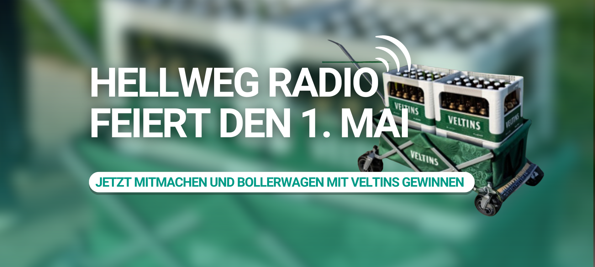 Aktionsgrafik von Hellweg Radio zum 1. Mai: Ein beladener Bollerwagen mit mehreren Kisten Veltins-Bier vor grünem Hintergrund. Text auf der Grafik: „Hellweg Radio feiert den 1. Mai - Jetzt mitmachen und Bollerwagen mit Veltins gewinnen."